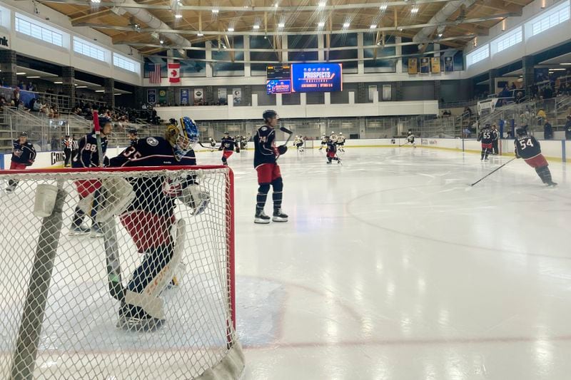 Columbus Blue Jackets goalie Evan Gardner prepares his crease as the Blue Jackets prepares to face the Boston Bruins in a Sabres Prospects Challenge hockey game in Buffalo, N.Y., Saturday, Sept. 14, 2024. (AP Photo/John Wawrow)