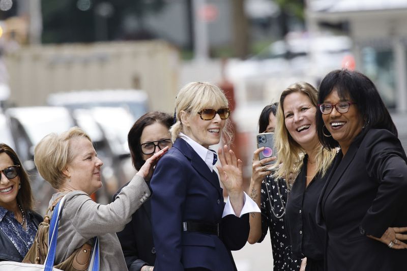 E. Jean Carroll greets people as she exits the New York Federal Court, after former President Donald Trump made an appearance, Friday, Sept. 6, 2024, in New York. (AP Photo/Eduardo Munoz Alvarez)