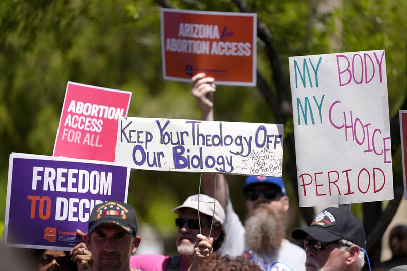 FILE - Abortion rights supporters gather outside the Capitol, Wednesday, April 17, 2024, in Phoenix. (AP Photo/Matt York, File)