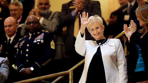 FILE - Sandra Deal waves as she is acknowledged by a round of applause before the State of the State address by her husband, Georgia Gov. Nathan Deal, on the House floor in Atlanta, Jan. 11, 2017. (AP Photo/David Goldman, File)