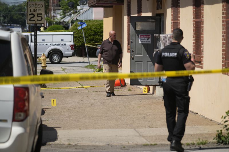 Investigators work the scene of a fatal shooting at Delaware County Linen in Chester, Pa., Wednesday, May 22, 2024. Authorities say a former employee armed with a handgun opened fire at a linen company in a Philadelphia suburb, killing multiple people and wounding three others. (AP Photo/Matt Rourke)