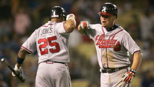 Atlanta Braves' Chipper Jones, right, is congratulated by teammate Andruw Jones after Chipper Jones homered during the eighth inning of the Braves' baseball game against the Los Angeles Dodgers, Thursday, July 5, 2007, in Los Angeles.