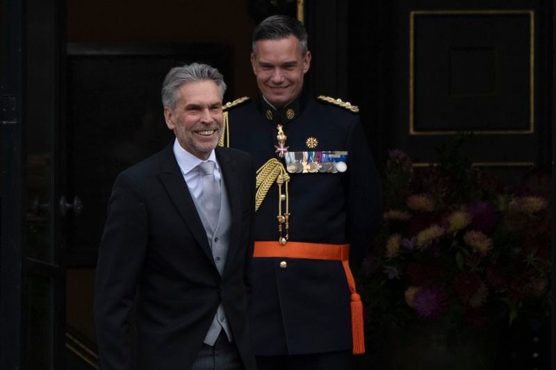 Incoming Prime Minister Dick Schoof, left, arrives at the royal palace to be sworn in by Dutch King Willem-Alexander in The Hague, Netherlands, Tuesday, July 2, 2024. (AP Photo/Peter Dejong)