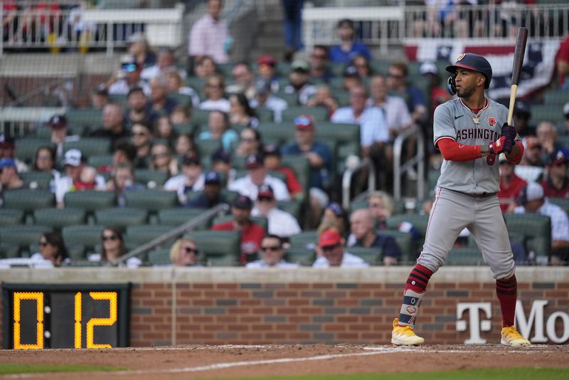 Washington Nationals outfielder Eddie Rosario (8) prepares to bat against the Atlanta Braves in the fifth inning of a baseball game, Monday, May 27, 2024, in Atlanta. (AP Photo/Mike Stewart)