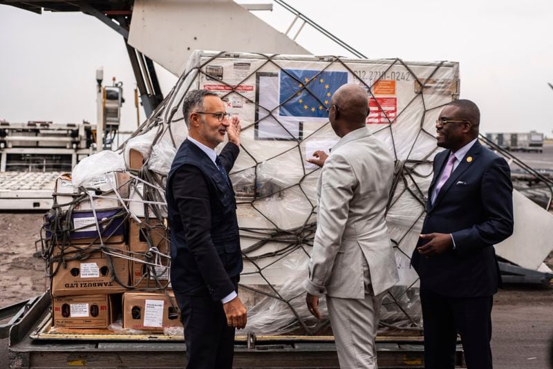 Officials check Mpox vaccine MVA-BN vaccine, manufactured by the Danish company Bavarian Nordic, at the airport in Kinshasa, Congo, Thursday, Sept. 5, 2024. (AP Photo/Samy Ntumba Shambuyi)