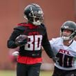 Atlanta Falcons wide receiver Josh Ali (80) runs after a catch against linebacker JD Bertrand (40) during minicamp at the Atlanta Falcons Training Camp, Tuesday, May 14, 2024, in Flowery Branch, Ga. (Jason Getz / AJC)
