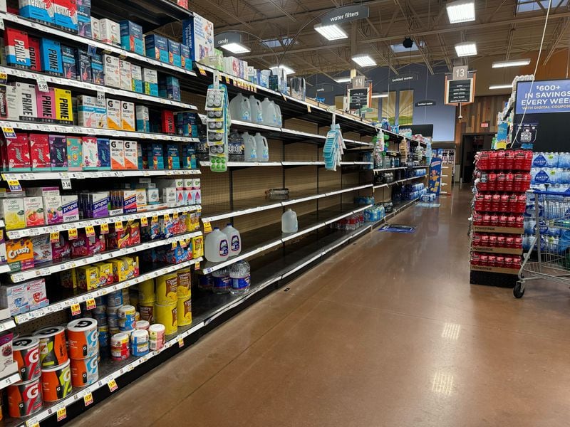 Shoppers have cleaned out the bottled water shelves at the Kroger on Glenwood Avenue on Thursday morning.