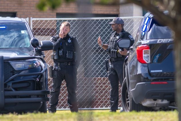 Barrow County law enforcement were posted outside the now fenced-in Apalachee High School on Thursday, Sept. 5, 2024. A 14-year-old is accused of shooting and killing two fellow students and two teachers and injuring nine others at the Barrow County school on Wednesday. (John Spink/AJC)