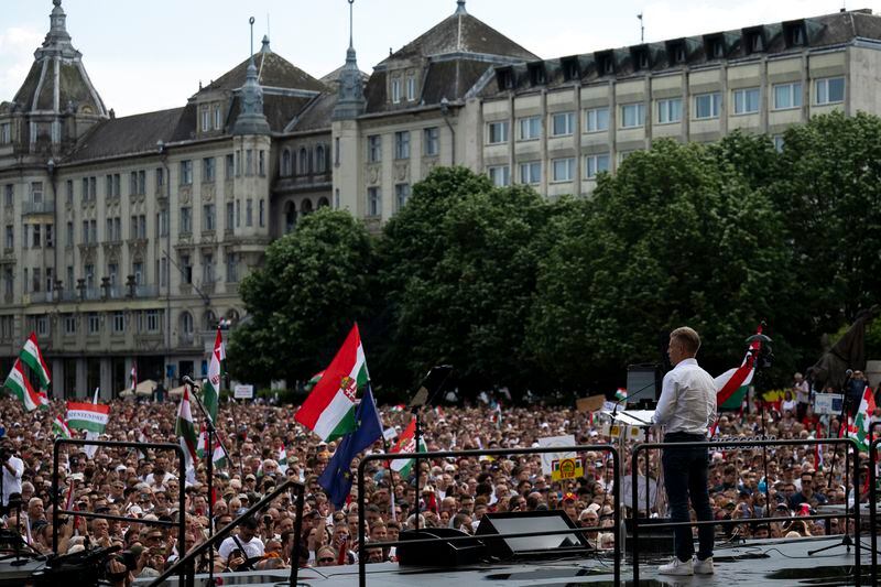 Péter Magyar, a rising challenger to Hungarian Prime Minister Viktor Orbán, addresses people at a campaign rally in the rural city of Debrecen, Hungary, on May 5, 2024. Magyar, 43, seized on growing disenchantment with the populist Prime Minister Viktor Orbán, building a political movement that in only a matter of weeks looks poised to become Hungary's largest opposition force. (AP Photo/Denes Erdos)