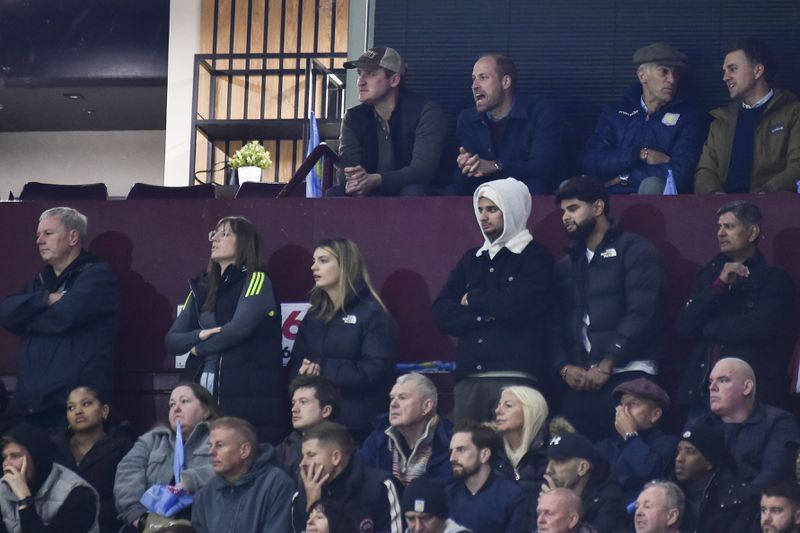 Britain's Prince William, second left in back row, reacts during the Champions League opening phase soccer match between Aston Villa and Bayern Munich, at Villa Park in Birmingham, England, Wednesday, Oct. 2, 2024. (AP Photo/Rui Vieira)