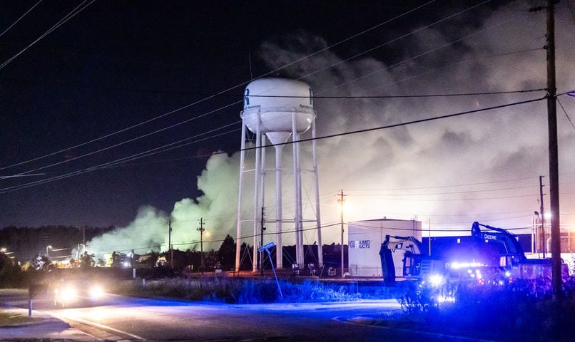 The plume of smoke rising from BioLab as seen from Old Covington Hwy continued on Thursday, Oct. 3, 2024 in Conyers. A Sunday fire at the chemical plant in Conyers has had agencies monitoring the air quality since then as crews try to neutralize the site. Rockdale County officials said that the plume is changing colors as workers remove debris. GEMA has advised anyone who notices a chlorine odor in the air to limit their time outdoors. (John Spink/AJC)