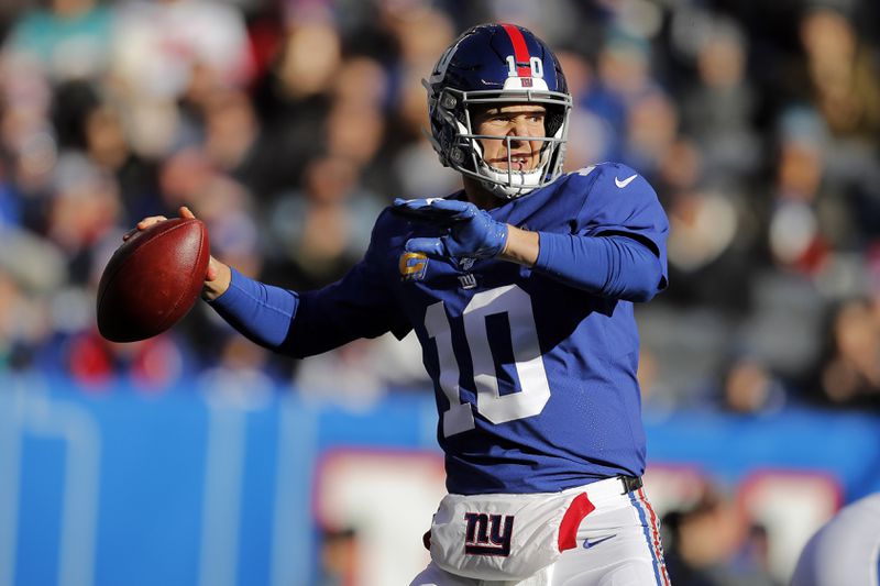 FILE - In this Dec. 15, 2019, file photo, New York Giants quarterback Eli Manning looks to pass in the first half of an NFL football game against the Miami Dolphins in East Rutherford, N.J. (AP Photo/Adam Hunger, File)