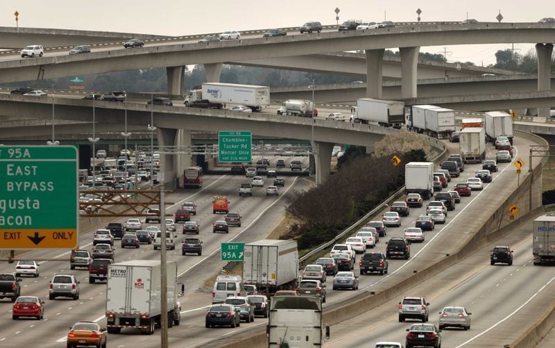 Automobiles travel through Spaghetti Junction, with some stacking up on the I-285 East ramp on a typical day. DeKalb County and metro Atlanta as a whole are projected to continue growing over the next 25 years. JASON GETZ / JGETZ@AJC.COM