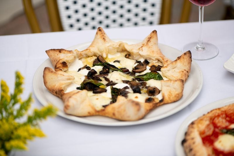 Amalfi Tartufo E Funghi Carnevale Pizza with gourmet mushroom blend, fontina, truffle oil, and ricotta-filled crust. (Mia Yakel for The Atlanta Journal-Constitution)