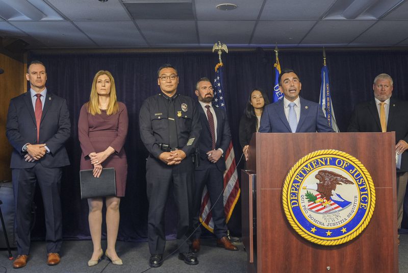 United States Attorney Martin Estrada, at podium, is joined by officials from left: Acting Inspector in Charge of the U.S. Postal Inspection Service's Los Angeles Division, Matthew Shields, Los Angeles Police Chief Dominic Choi, DEA Administrator Anne Milgram, and other officials to announce court filings related to the death of actor Matthew Perry in Los Angeles on Thursday, Aug. 15, 2024. (AP Photo/Damian Dovarganes)