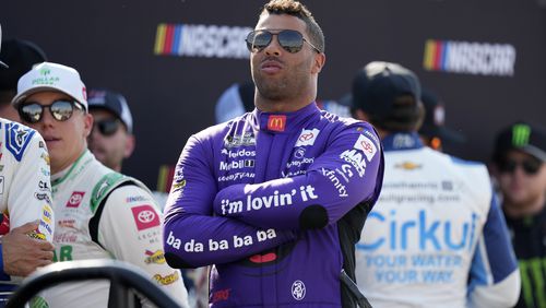 Bubba Wallace looks on before driver introductions at a NASCAR Cup Series auto race, Sunday, June 16, 2024, at Iowa Speedway in Newton, Iowa. (AP Photo/Charlie Neibergall)