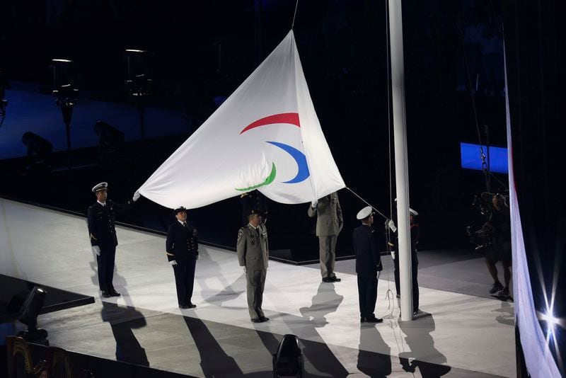 The Paralympic flag is raised during the Opening Ceremony for the 2024 Paralympics, Wednesday, Aug. 28, 2024, in Paris, France. (AP Photo/Thomas Padilla)