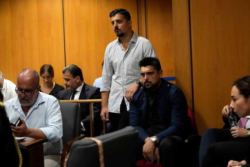 Andrea Varriale, top left, colleague of Italian Carabinieri paramilitary police officer Mario Cerciello Rega, and Paolo Cerciello Rega, his brother, attend the appeal trial of Gabriel Natale-Hjorth and Finnegan Lee Elder where they are accused of slaying the Carabinieri paramilitary police officer in Rome, Wednesday, July 3, 2024. (AP Photo/ Alessandra Tarantino)