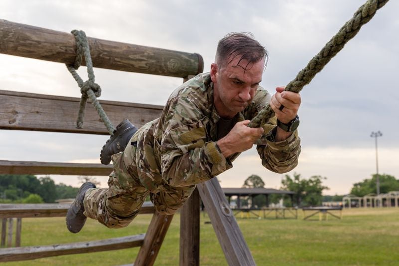 75th Ranger Regiment Army Maj. Jack Gibson navigates an obstacle course as part of his physical training at Fort Moore in Columbus on Friday, May 3, 2024. (Arvin Temkar / AJC)