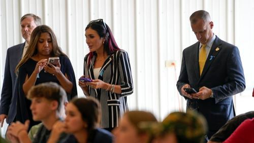 Lynne Patton, Laura Loomer and Corey Lewandowski watch as Republican presidential nominee former President Donald Trump visits the Shanksville Volunteer Fire Company in Shanksville, Pa., Wednesday, Sept. 11, 2024. (AP Photo/Matt Rourke)