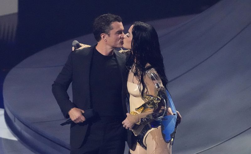 Orlando Bloom, left, kisses Katy Perry as he presents the video vanguard award to her during the MTV Video Music Awards on Wednesday, Sept. 11, 2024, at UBS Arena in Elmont, N.Y. (Photo by Charles Sykes/Invision/AP)