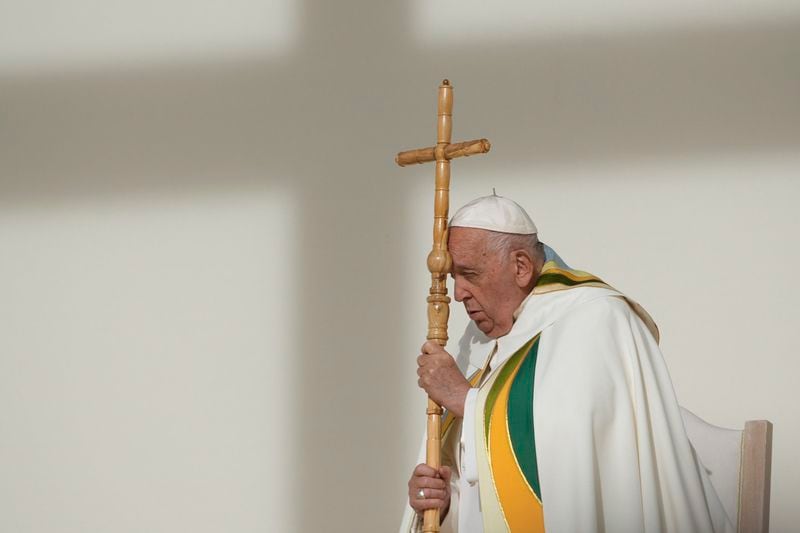 Pope Francis holds the pastoral staff as he presides over the Sunday mass at King Baudouin Stadium, in Brussels Sunday, Sept. 29, 2024. (AP Photo/Andrew Medichini)