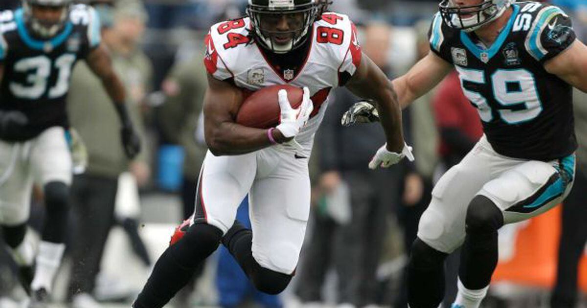 Roddy White celebrates after a touchdown with a t-shirt that reads