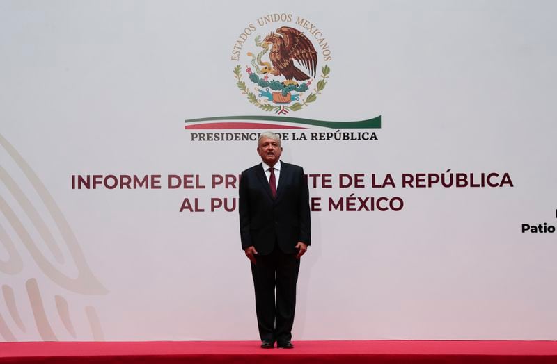 FILE - Mexican President Andres Manuel Lopez Obrador stands before giving an address to the nation at the National Palace in Mexico City, April 5, 2020. (AP Photo/Eduardo Verdugo, File)