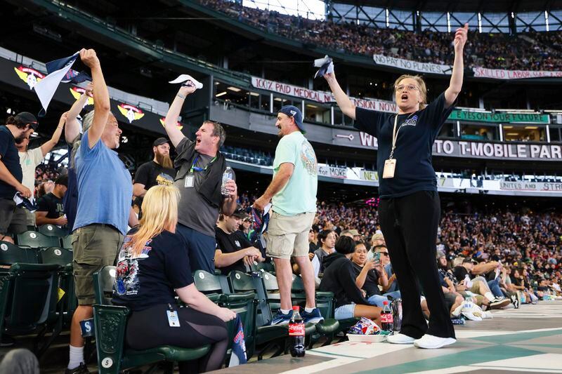 FILE - A Boeing machinist and union member leads cheers during the "stop work meeting" and strike sanction at T-Mobile Park in Seattle, July 17, 2024. (Kevin Clark/The Seattle Times via AP, File)