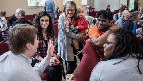 Kirsten Browning (from left), Michelle Caruso, Jaine Alexander, who is holding 14-month-old Henry, Kylan Pew and Mirissa Tucker talk in a group as part of a worship service at Neighborhood Church on Oct. 20, 2019, in Atlanta. Two churches — Druid Hills United Methodist Church and Epworth United Methodist Church — merged to form the new church. BRANDEN CAMP / SPECIAL