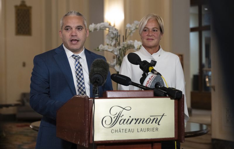 Fairmont Chateau Laurier General Manager Genevieve Dumas listens to Ottawa Police Services Detective Akiva Gellar speak about the stolen Yousuf Karsh portrait of Winston Churchill, during a news conference in the hotel in Ottawa, Canada, Wednesday, Sept. 11, 2024. (Adrian Wyld/The Canadian Press via AP)