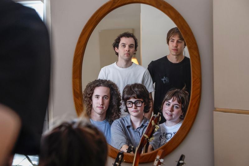 Rock band Lunar Vacation poses for a portrait inside their home studio in Decatur on Tuesday, Aug. 20, 2024. (Natrice Miller/AJC)