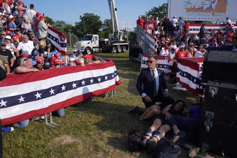 FILE - People react during a campaign rally with Republican presidential candidate former President Donald Trump at a campaign rally, July 13, 2024, in Butler, Pa. (AP Photo/Evan Vucci, File)