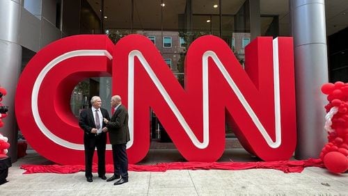 On Sept. 24, 2024, CNN CEO Mark Thompson meets with former CNN president Tom Johnson at the Midtown Turner campus in Atlanta for the unveiling of the CNN logo previously at CNN Center for more than 25 years. CONTRIBUTED