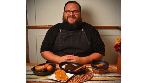 Atlanta chef Christian Lopez of Humo Cuisine shows some of his Colombian dishes: (from left) Colombian Buñuelos with coffee, Fried Green Plantains, Posta Negra Cartagenera (beef roast in the manner of the city of Cartagena), served with rice and Fried Green Plantains, and Chuyaco (navel orange salad). (Styling by Christian Lopez / Chris Hunt for the AJC)