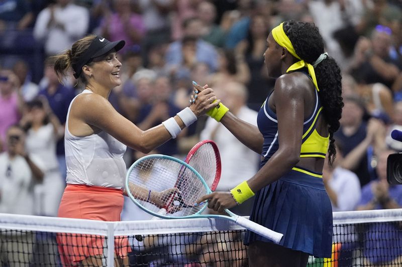 Coco Gauff, right, of the United States, shakes hands with Tatjana Maria, of Germany, during a second round match of the U.S. Open tennis championships, Wednesday, Aug. 28, 2024, in New York. (AP Photo/Frank Franklin II)