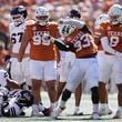 Texas linebacker David Gbenda (33) celebrates after a stop during the first half of an NCAA college football game against Mississippi State in Austin, Texas, Saturday, Sept. 28, 2024. (AP Photo/Eric Gay)