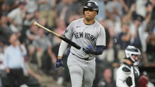 New York Yankees' Juan Soto tosses his bat after hitting a home run off Chicago White Sox relief pitcher Fraser Ellard, Soto's third of the game, during the seventh inning of a baseball game Tuesday, Aug. 13, 2024, in Chicago. (AP Photo/Charles Rex Arbogast)