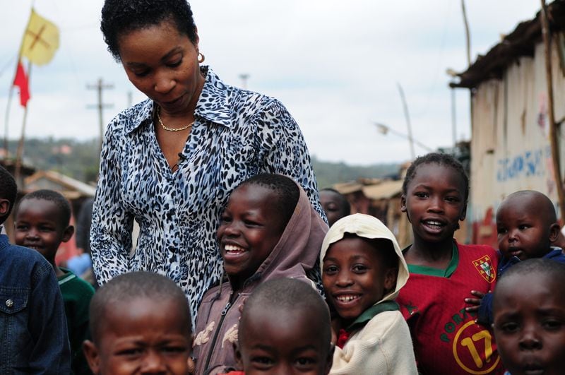 Dr. Helene Gayle shown in May 2013 with local children in Nairobi, Kenya. Forbes magazine listed Dr. Gayle as the 78th most powerful woman in the world in 2014.  (Photo: Handout)