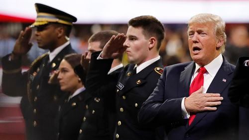 President Donald Trump sings the national anthem before the NCAA college football playoff championship game between Georgia and the AlabamaMonday, Jan. 8, 2018, in Atlanta. (AP Photo/David Goldman)