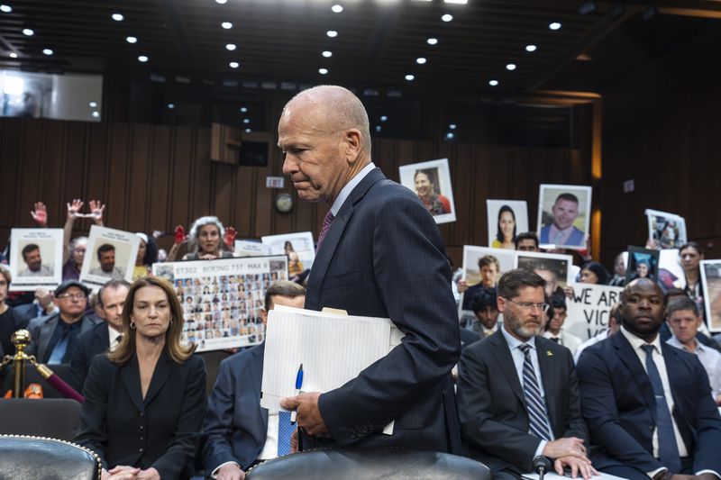 FILE - With protesters in the audience, Boeing CEO Dave Calhoun arrives to testify before a Senate subcommittee to answer to lawmakers about troubles at the aircraft manufacturer. Ike Riffel , a California father whose two sons, died in 2019 when a Boeing 737 Max jetliner crashed in Ethiopia, fears that instead of putting Boeing on trial, the government will offer the company another shot at corporate probation through a legal document called a deferred prosecution agreement, or DPA. (AP Photo/J. Scott Applewhite, File)
