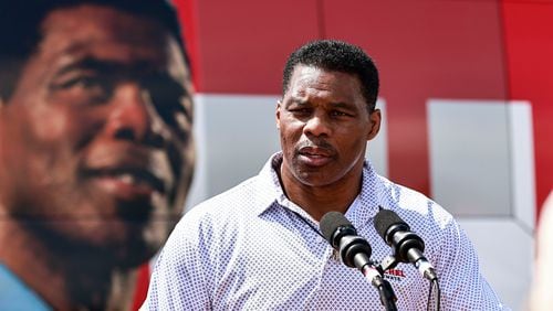 Republican U.S. Senate candidate Herschel Walker's campaign is questioning his former high school coach's support for U.S. Sen. Raphael Warnock. (Natrice Miller/The Atlanta Journal-Constitution/TNS)