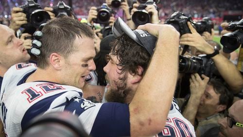 New England Patriots quarterback Tom Brady shares a moment with his teammate David Andrews after beating the Atalnta Falcons 34-28 on Sunday, Feb. 5 , 2017 during the NFL Super Bowl LI football game at the NRG Stadium in Houston, Texas.
