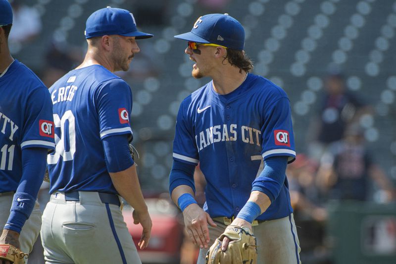 Kansas City Royals' Bobby Witt Jr., right, congratulates Lucas Erceg, left, at the end of the first game of a baseball doubleheader against the Cleveland Guardians in Cleveland, Monday, Aug. 26, 2024. (AP Photo/Phil Long)