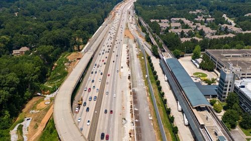 Aerial photo shows Ga. 400 (R-Northbound, L-Southbound), where toll lanes will be built on Thursday, July 22, 2021. North Springs MARTA station is shown on right. Sixteen miles of toll lanes are planned that will stretch from the North Springs MARTA station in Fulton County to about one mile north of McFarland Parkway in Forsyth County. (Hyosub Shin / Hyosub.Shin@ajc.com)