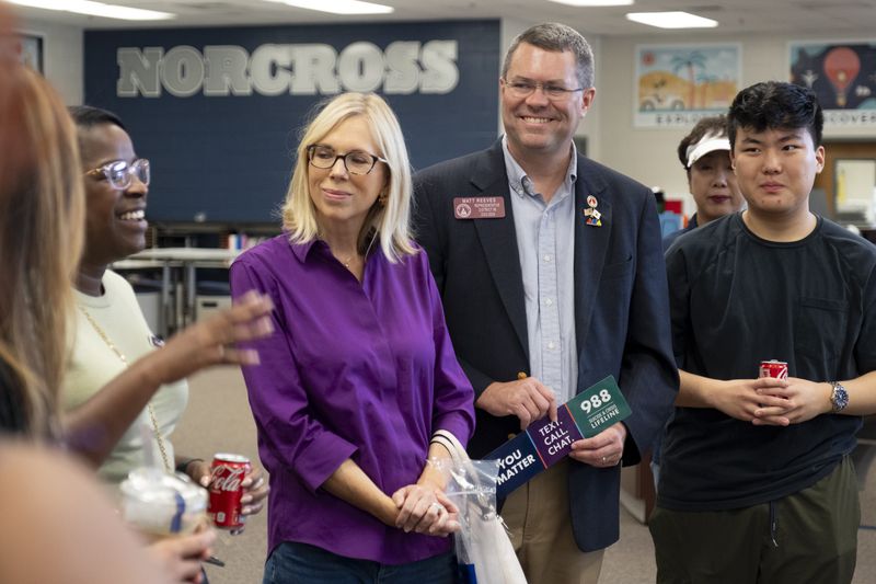 State Rep. Matt Reeves, R-Duluth, with his wife, Suzette beside him, says he doesn't discuss Donald Trump while campaigning in his district. “Every once in a while, I’ll get a question about the presidential race, and I’ll do a lot of listening, but there’s very little common ground there and I don’t spend a lot of time on that,” he said. (Ben Gray / Ben@BenGray.com)