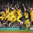 The Savannah Bananas celebrate a run when they took their World Tour to a sold-out Fenway Park on Saturday, June 8, 2024, as they played the Party Animals before over 37,000 fans in Boston. (John Tlumacki/The Boston Globe)