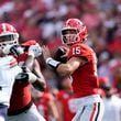 Georgia quarterback Carson Beck (15) throws from the pocket in the first half of an NCAA college football game against Auburn Saturday, Oct. 5, 2024, in Athens, Ga. (AP Photo/John Bazemore)