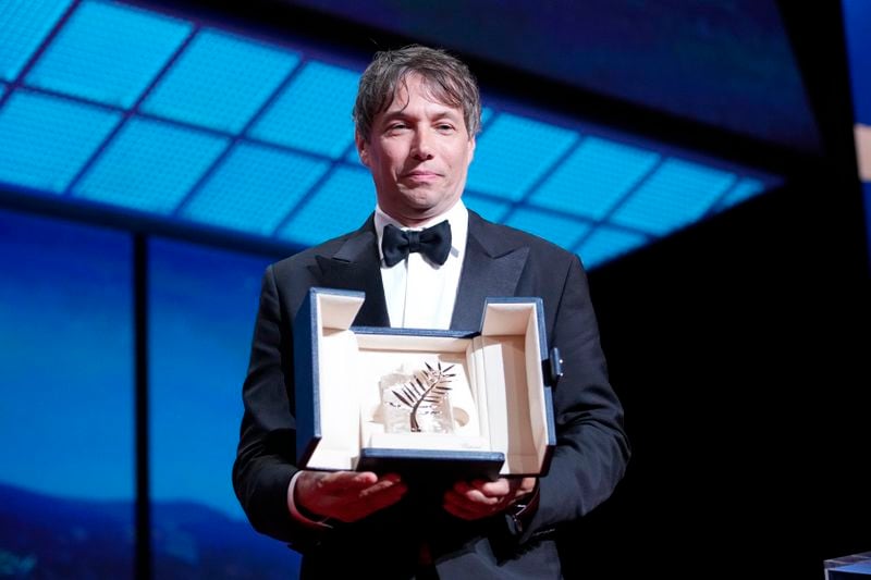 Sean Baker holds the Palme d'Or for the film 'Anora,' during the awards ceremony of the 77th international film festival, Cannes, southern France, Saturday, May 25, 2024 (Photo by Andreea Alexandru/Invision/AP)