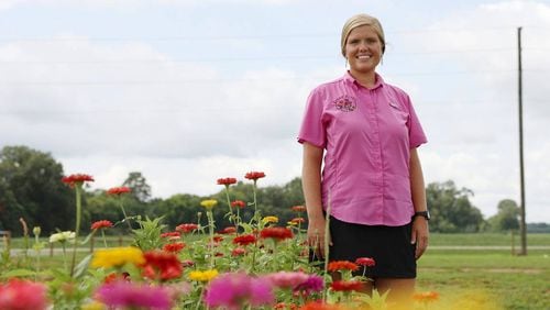 Arena Acres founder Samantha Lineberger poses in rows of flowers on Arena Acres flower farm on Thursday, July 25, 2024, in Perry, Georgia. The land that Arena Acres is now on has been in Linebarger’s family for over seventy years. (Photo Courtesy of Katie Tucker/The Telegraph)